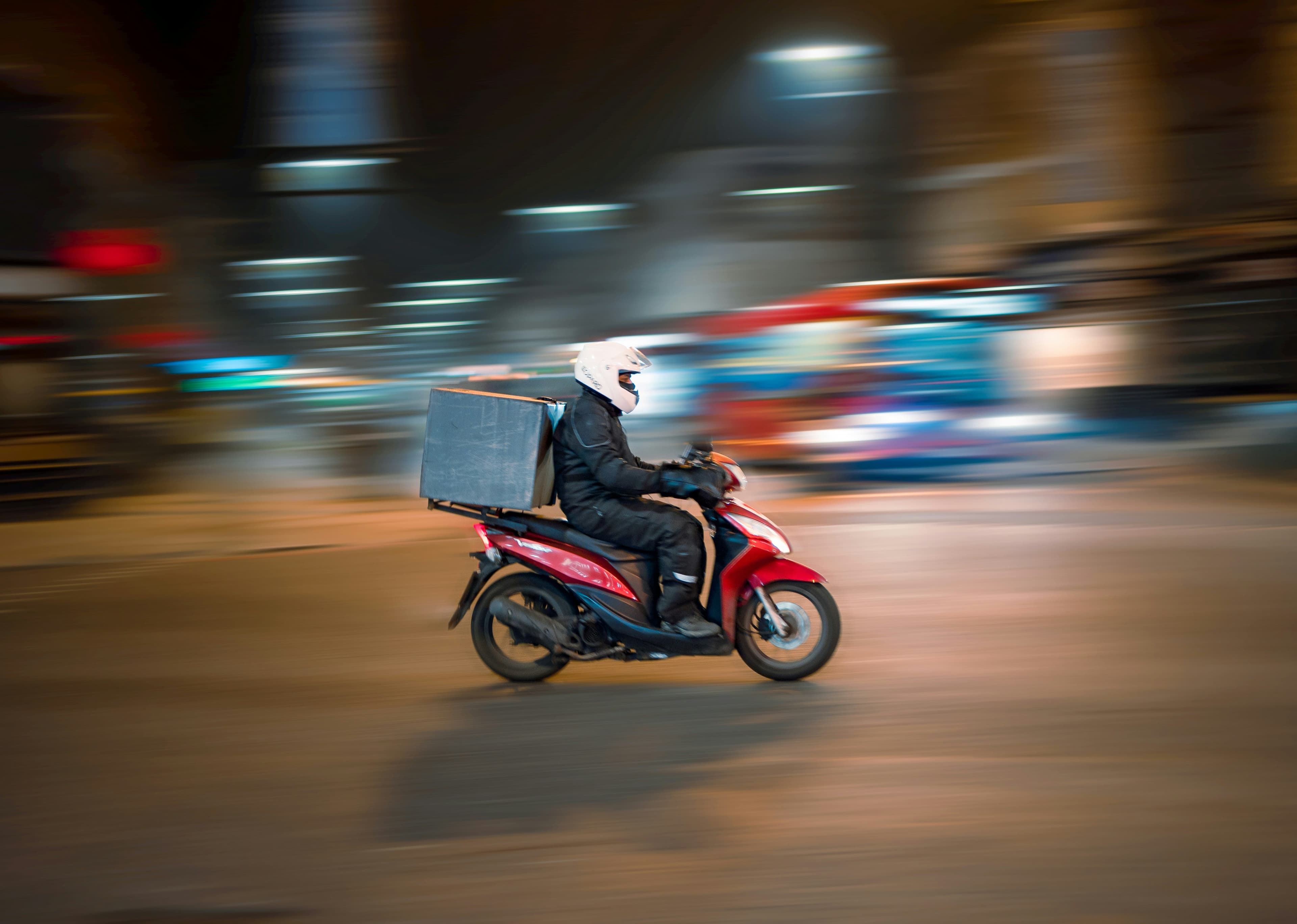 Scooter moving through city traffic